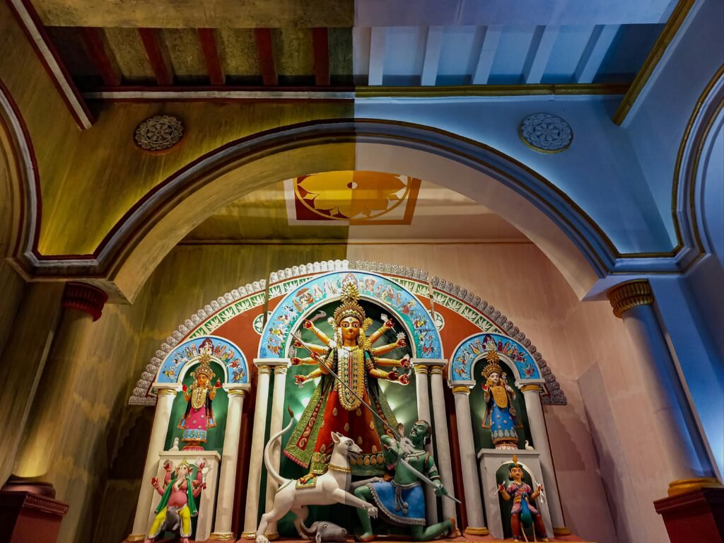 Intricately decorated Durga Puja pandal showcasing Hindu deities in Kolkata, India.
